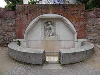 Wandbrunnen Trinkender Jüngling